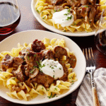 Beef Stroganoff with Buttered Noodles served over egg noodles