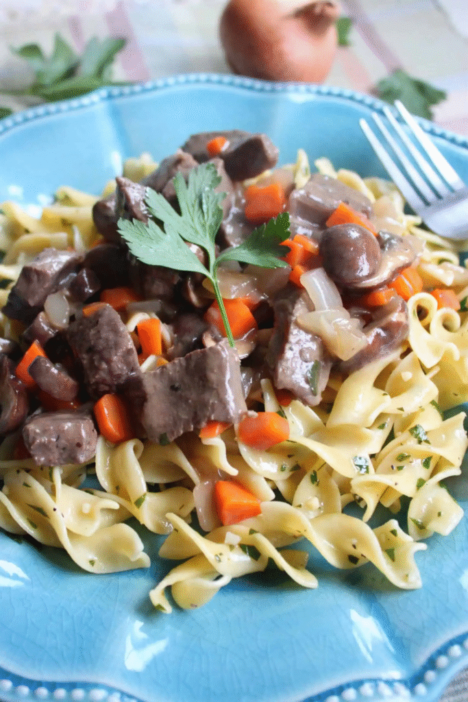 sautéing mushrooms, onions, and garlic for Beef Stroganoff with Buttered Noodles
