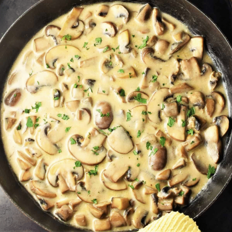 bowl of pan sauce made with sour cream and mushrooms