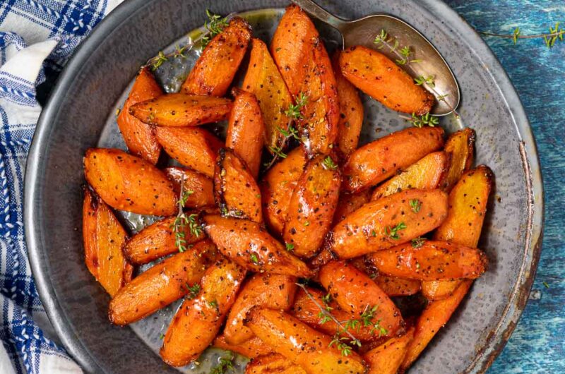 Air Fryer Carrots with caramelized edges in a white bowl
