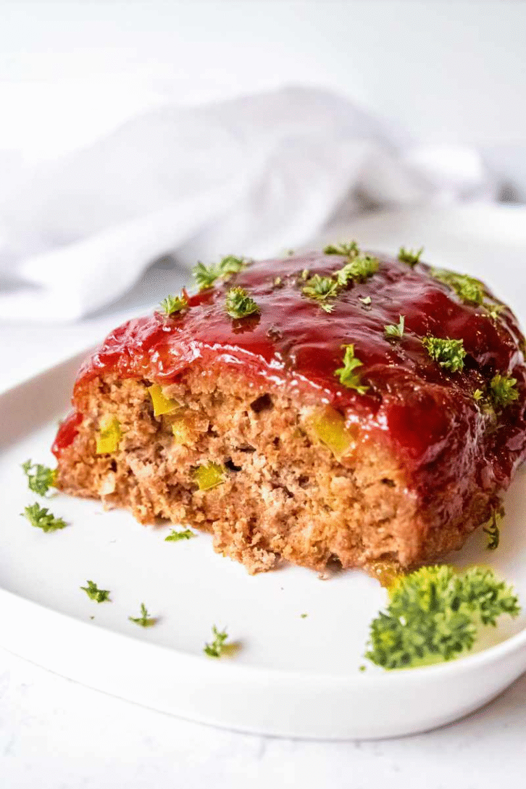 Meatloaf Recipe with tangy glaze and parsley garnish